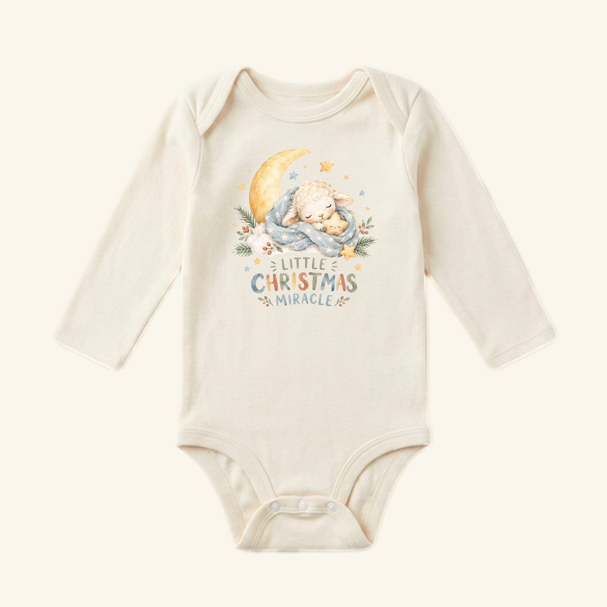 Toodleroos Little Christmas Miracle Baby Onesie, a long-sleeve cream baby bodysuit featuring a sleeping lamb on a crescent moon with the text Little Christmas Miracle below.