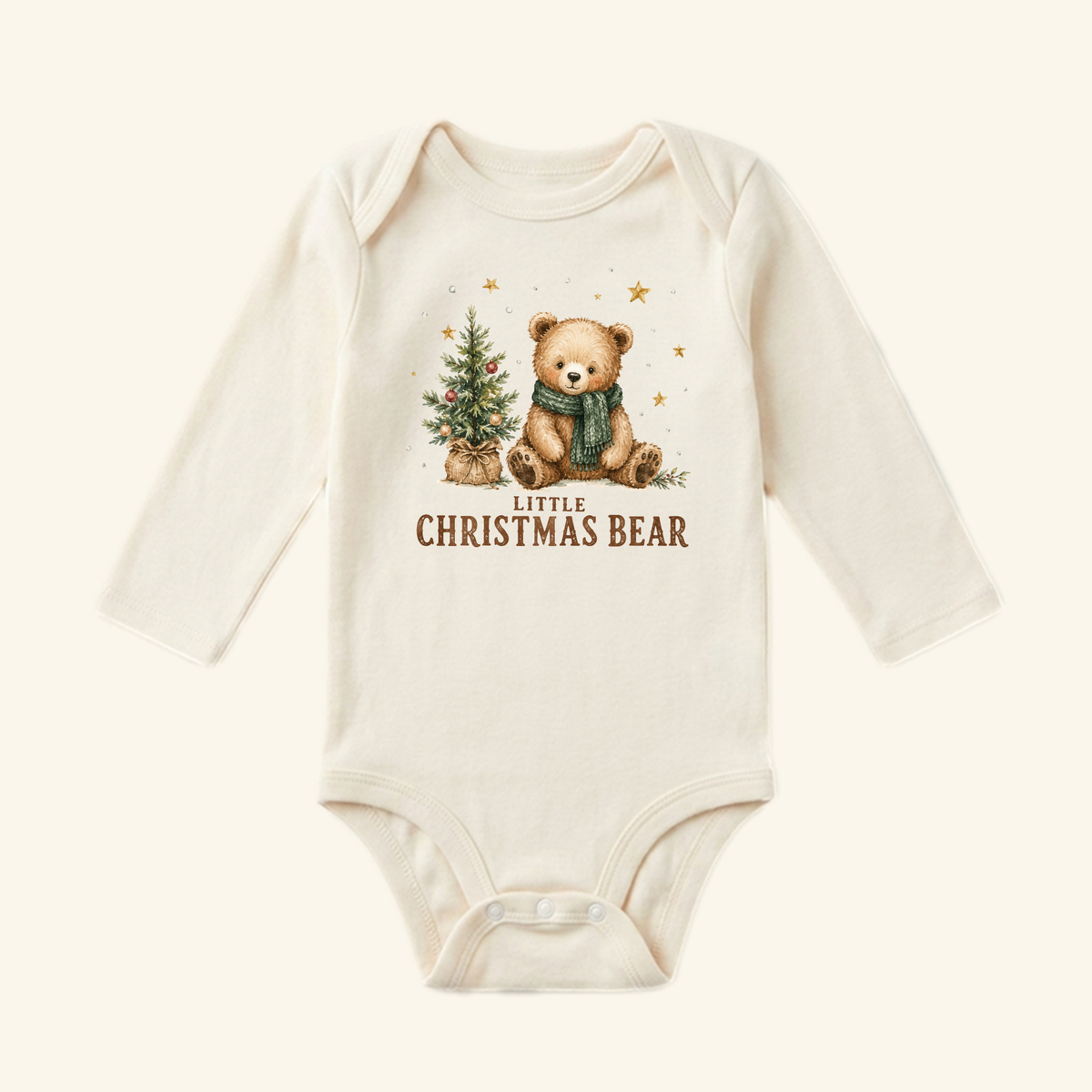 Cream-colored long-sleeve Little Christmas Bear Baby Onesie – Cute Teddy Bear Christmas Bodysuit featuring a teddy bear in a scarf next to a small Christmas tree with the text LITTLE CHRISTMAS BEAR underneath.