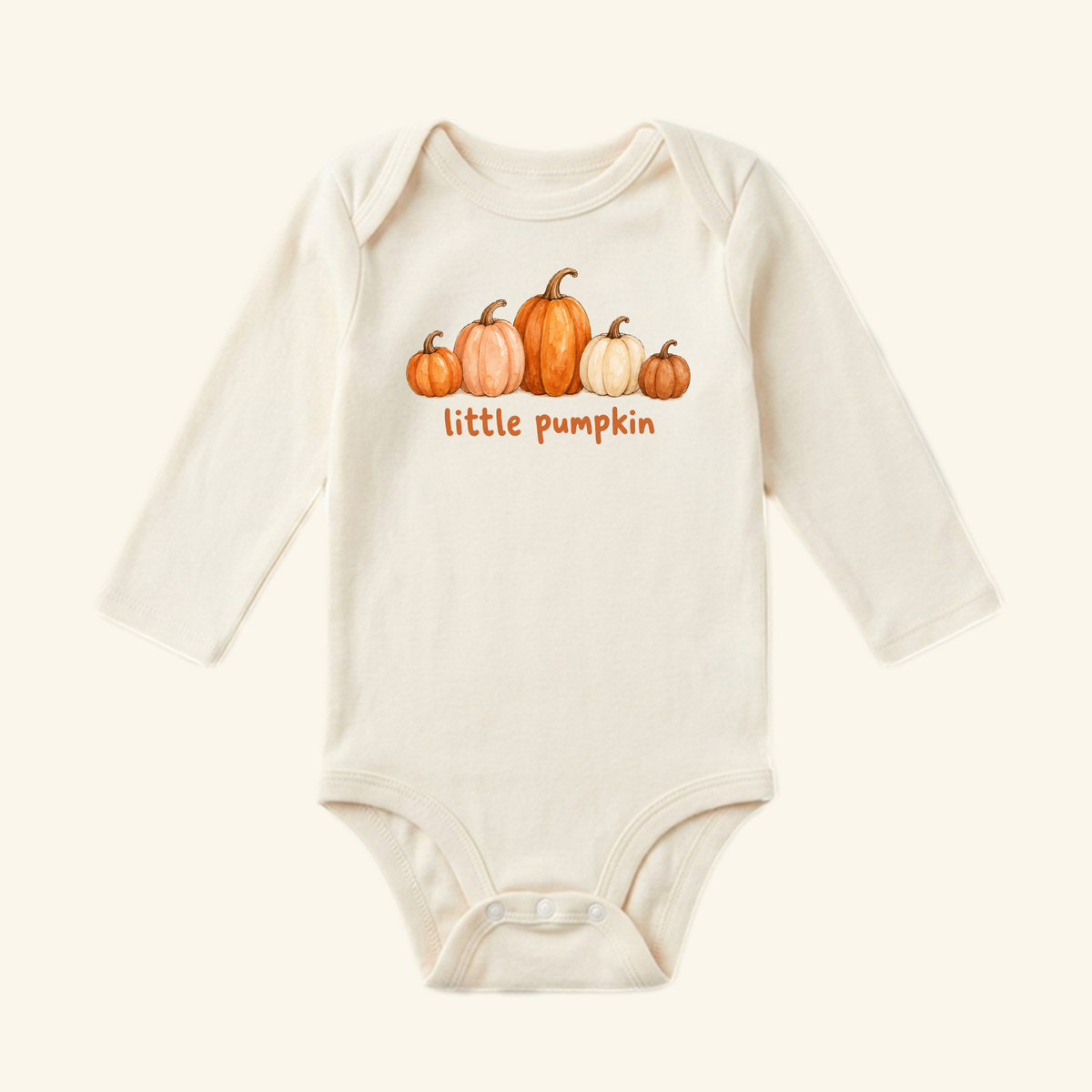 Cream-colored long-sleeve Little Pumpkin Baby Onesie – Watercolor Fall Pumpkin Bodysuit featuring a watercolor illustration of five pumpkins and the text little pumpkin.