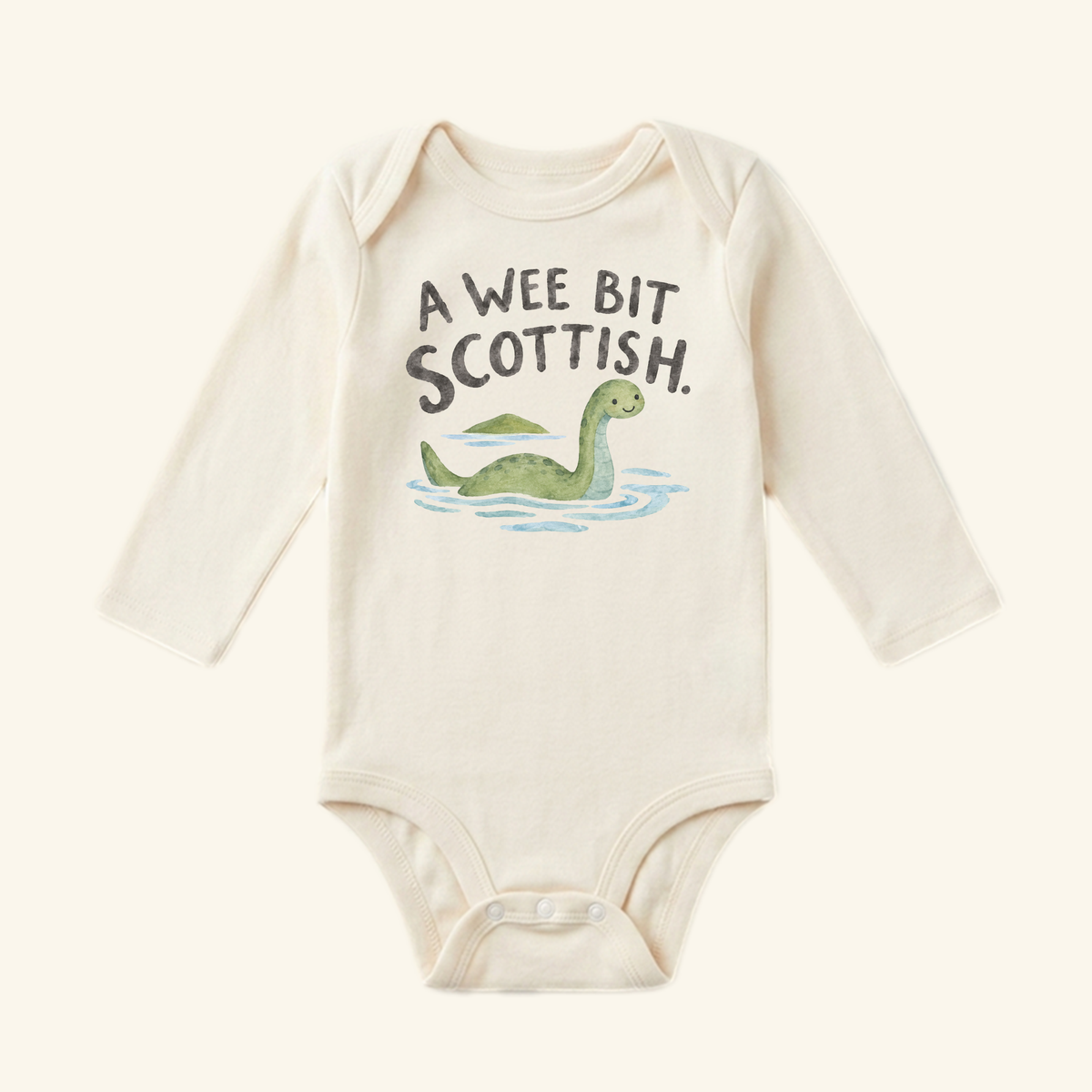 A Wee Bit Scottish Baby Onesie – Cute Loch Ness Monster Heritage Bodysuit featuring a long-sleeve bodysuit with a watercolor illustration of the Loch Ness monster and the text A Wee Bit Scottish.