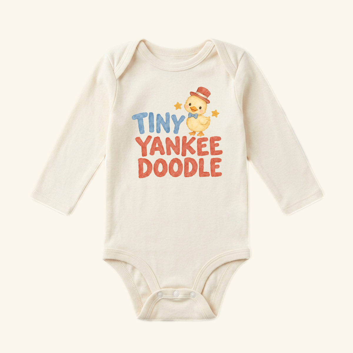 Cream-colored long-sleeve Tiny Yankee Doodle Baby Onesie – Patriotic Duckling Bodysuit featuring a yellow duckling in a red top hat and blue bowtie, with TINY YANKEE DOODLE in blue and red block lettering.