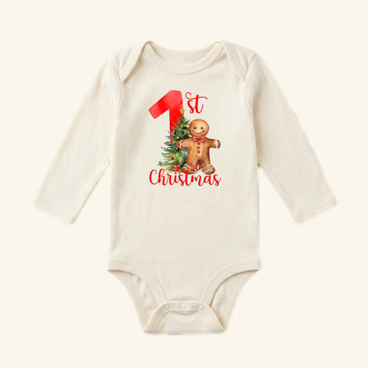 Toodleroos Baby’s First Christmas Onesie – Gingerbread Holiday Bodysuit in cream with a gingerbread man, a Christmas tree, and the text 1st Christmas.