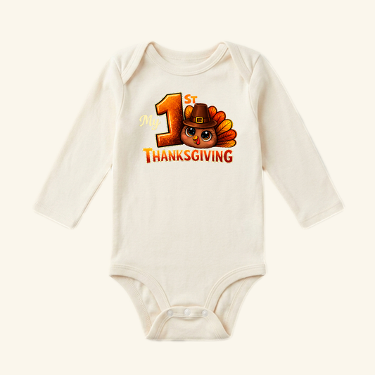 Cream-colored long-sleeve My 1st Thanksgiving Baby Onesie – Turkey Bodysuit featuring a turkey in a pilgrim hat and the text My 1st Thanksgiving.