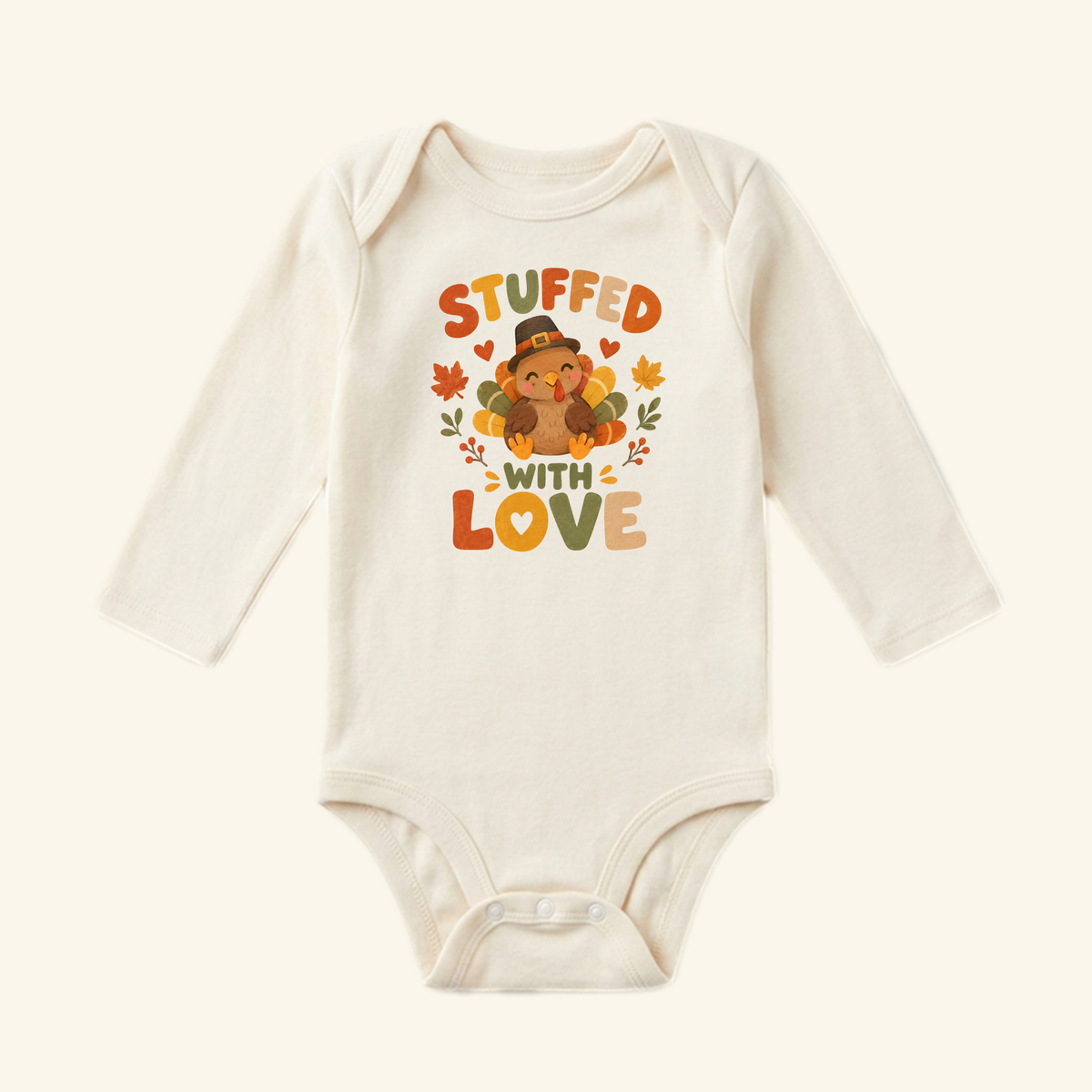 Stuffed With Love Baby Onesie – Thanksgiving Turkey Bodysuit featuring a turkey in a pilgrim hat surrounded by autumn leaves and the text Stuffed with Love.