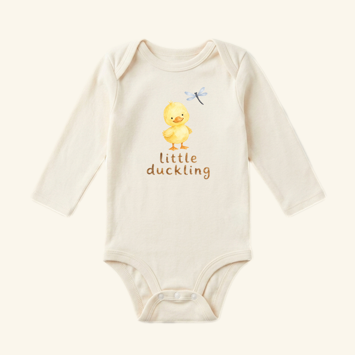 Little Duckling Baby Onesie featuring a watercolor illustration of a duckling, a dragonfly, and the text little duckling.