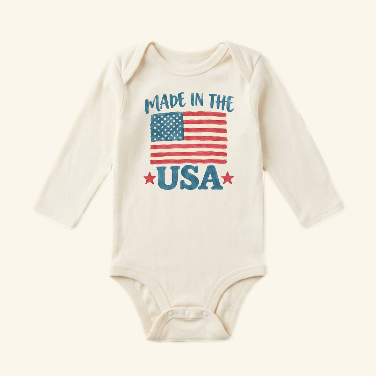 Toodleroos Made in the USA Baby Onesie – Patriotic American Flag Bodysuit featuring an American flag graphic, the text MADE IN THE USA, and two red stars.