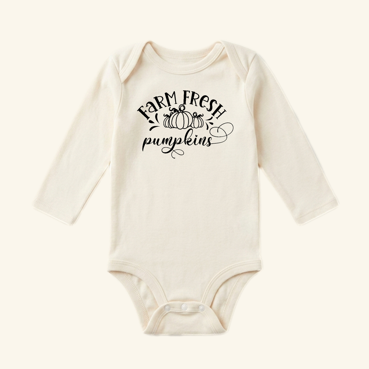 Toodleroos Farm Fresh Pumpkins Baby Onesie – Fall Farmhouse Pumpkin Bodysuit in cream with long sleeves, featuring a pumpkin illustration and Farm Fresh Pumpkins text on the chest.