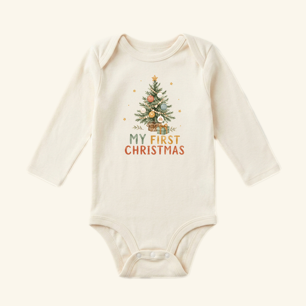 Cream-colored long-sleeve My First Christmas Baby Onesie – Boho Christmas Tree Bodysuit by Toodleroos featuring a boho Christmas tree illustration.