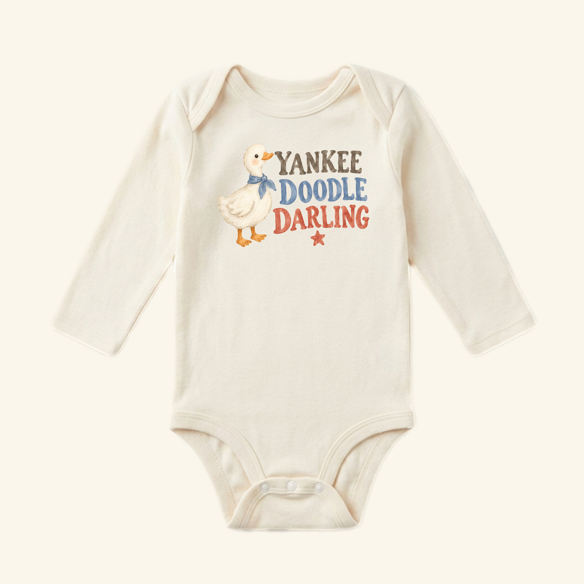Yankee Doodle Darling Baby Onesie – Patriotic Duckling Bodysuit, a long-sleeved Americana baby bodysuit featuring a duck in a blue scarf, the text Yankee Doodle Darling, and a small red star.