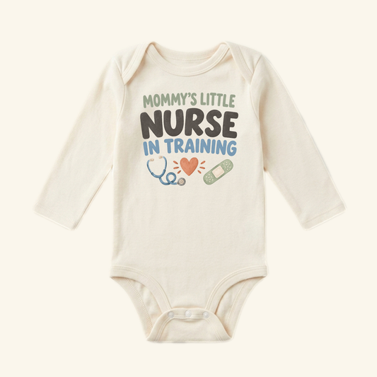 Mommy’s Little Nurse in Training Baby Onesie featuring the text Mommy’s little nurse in training above illustrations of a stethoscope, a heart, and a bandage.