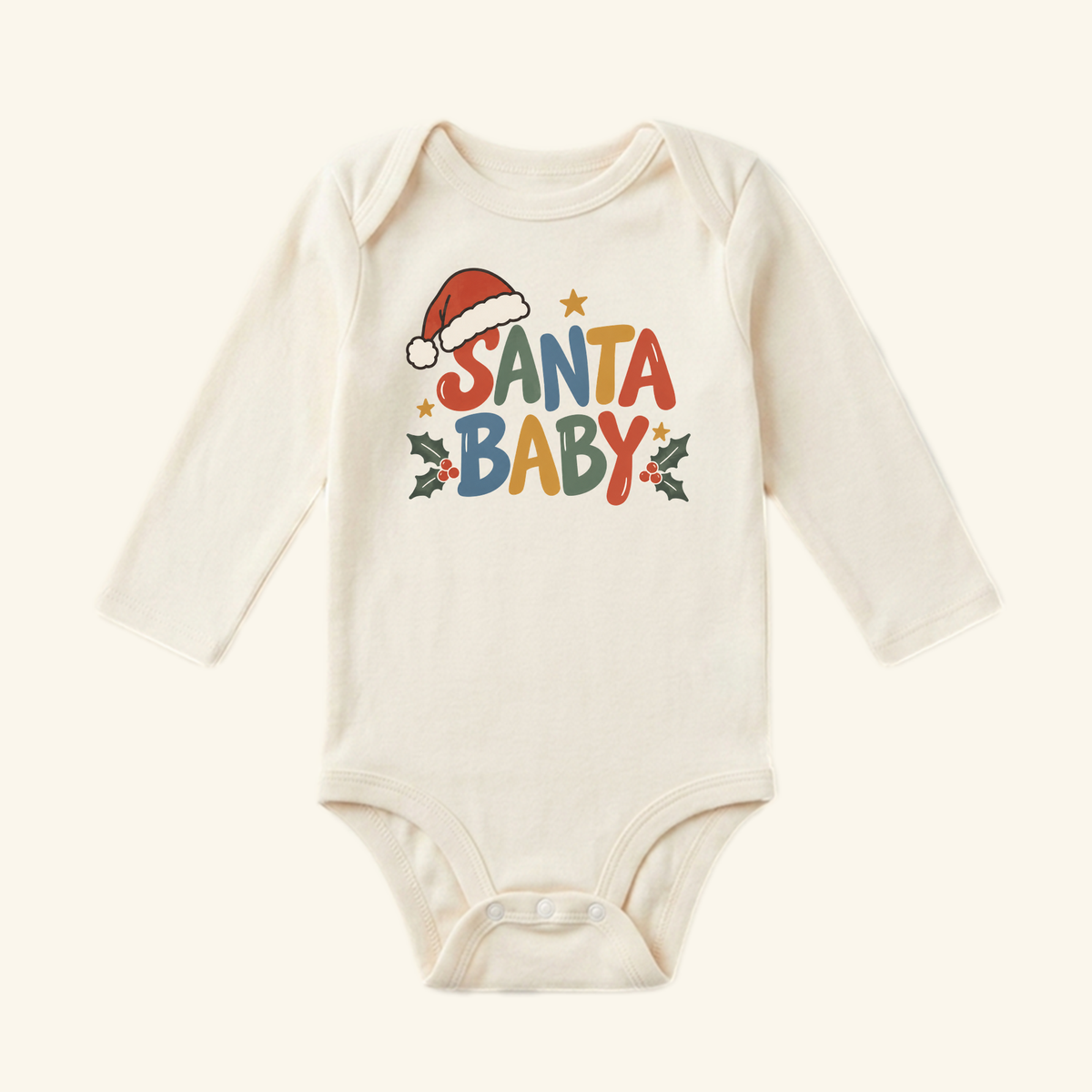 Toodleroos Santa Baby Onesie – Retro Christmas Santa Hat Bodysuit in cream with long sleeves, featuring retro-style SANTA BABY lettering accented by a Santa hat, stars, and holly leaves.