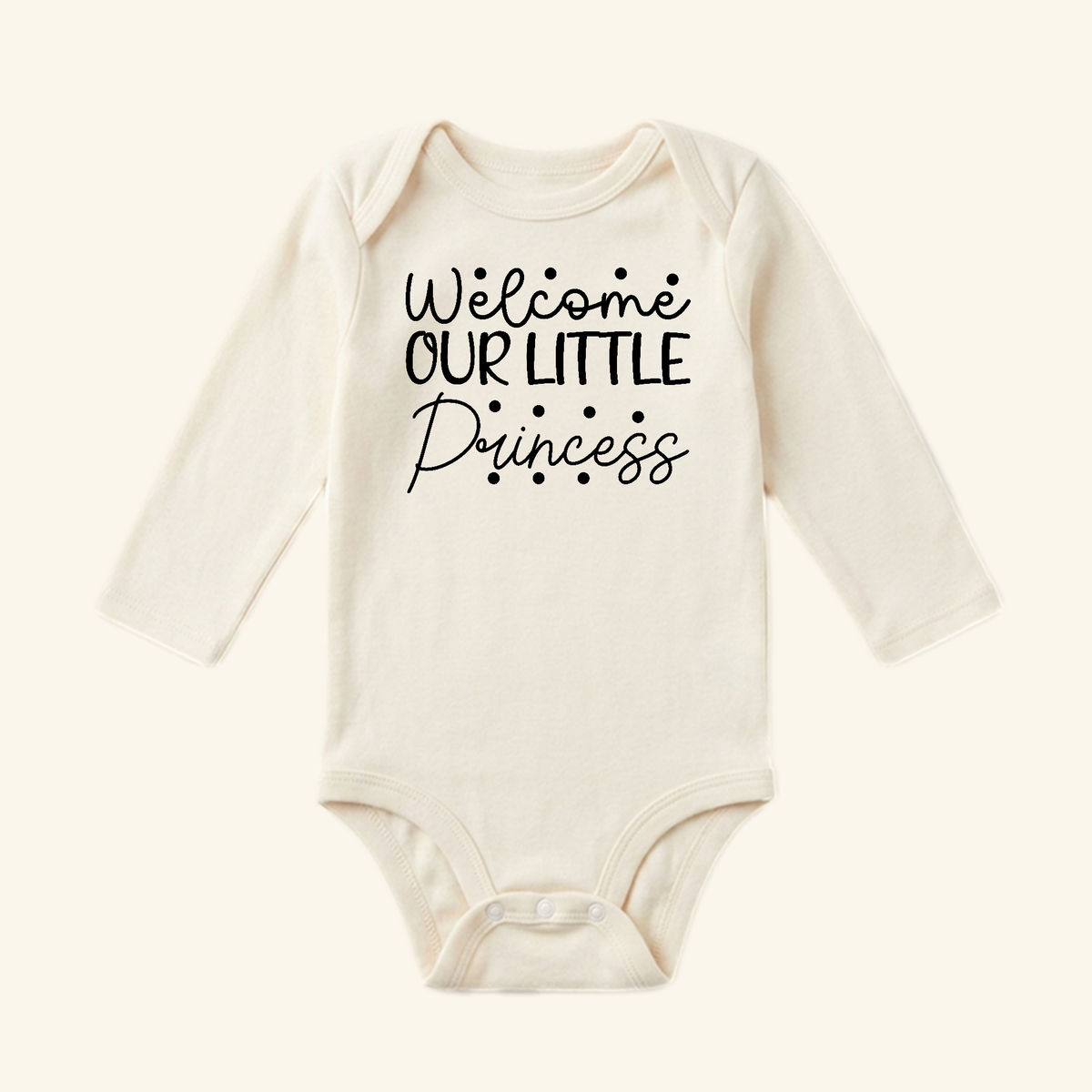 Cream long-sleeve Toodleroos Baby Girl Onesie – Welcome Our Little Princess Bodysuit featuring the text Welcome OUR LITTLE Princess in black script.