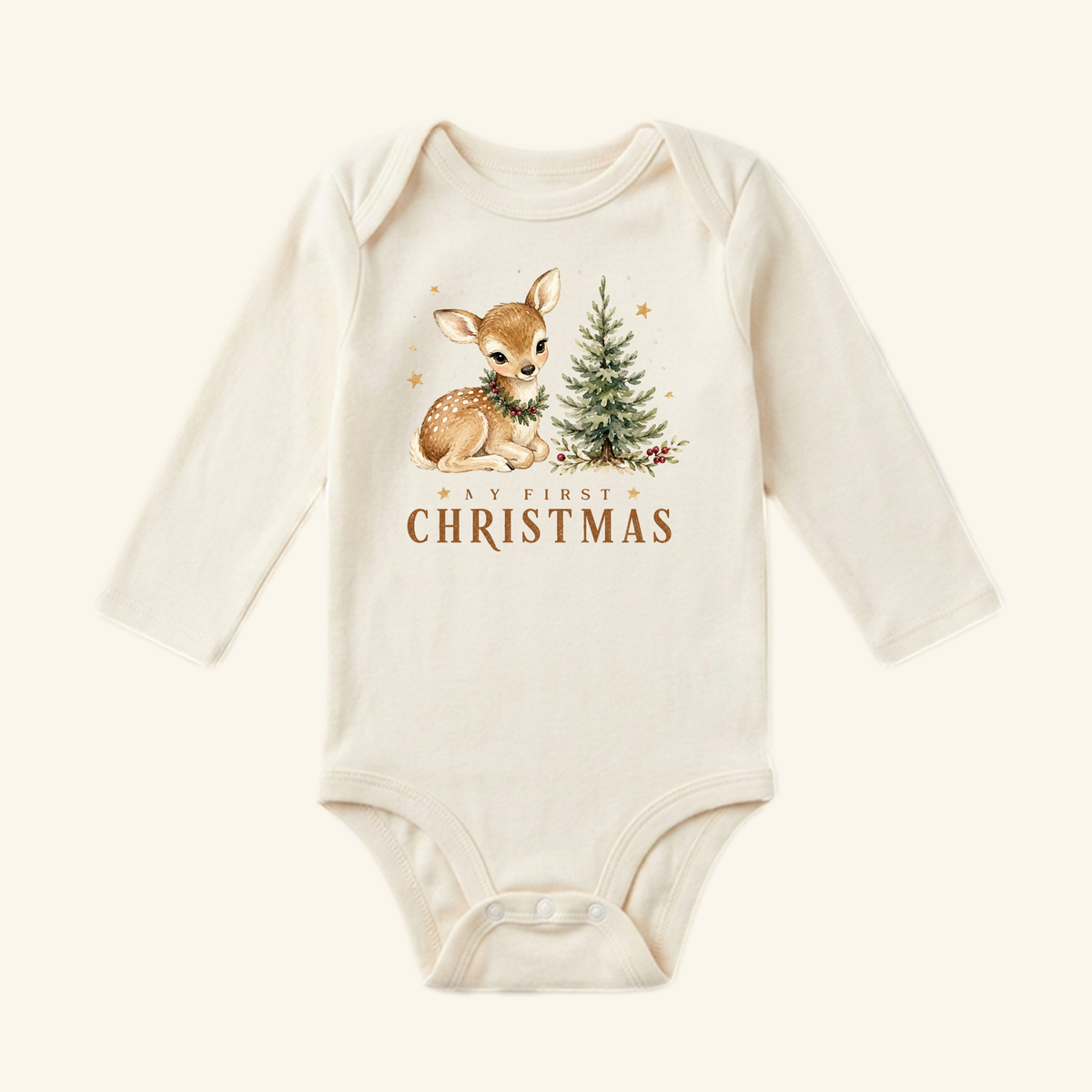 Cream-colored long-sleeve My First Christmas Baby Onesie – Woodland Fawn Bodysuit featuring a printed illustration of a fawn with a wreath and a pine tree.