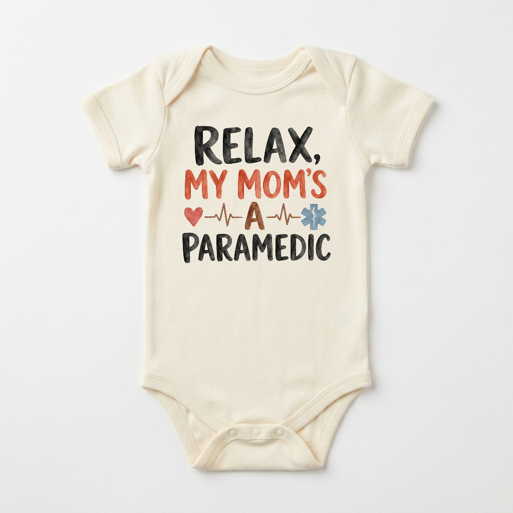 Introducing the Toodleroos Paramedic Mom Baby Onesie – My Mom’s a Paramedic Short-Sleeve Bodysuit! This ivory baby bodysuit displays the playful message “RELAX, MY MOM’S A PARAMEDIC” in black and red, accented by a red heart, heartbeat line, and blue star of life symbol. Set against a plain white background, this adorable onesie is an ideal gift for paramedic moms or a unique baby shower present for families celebrating their real-life heroes.