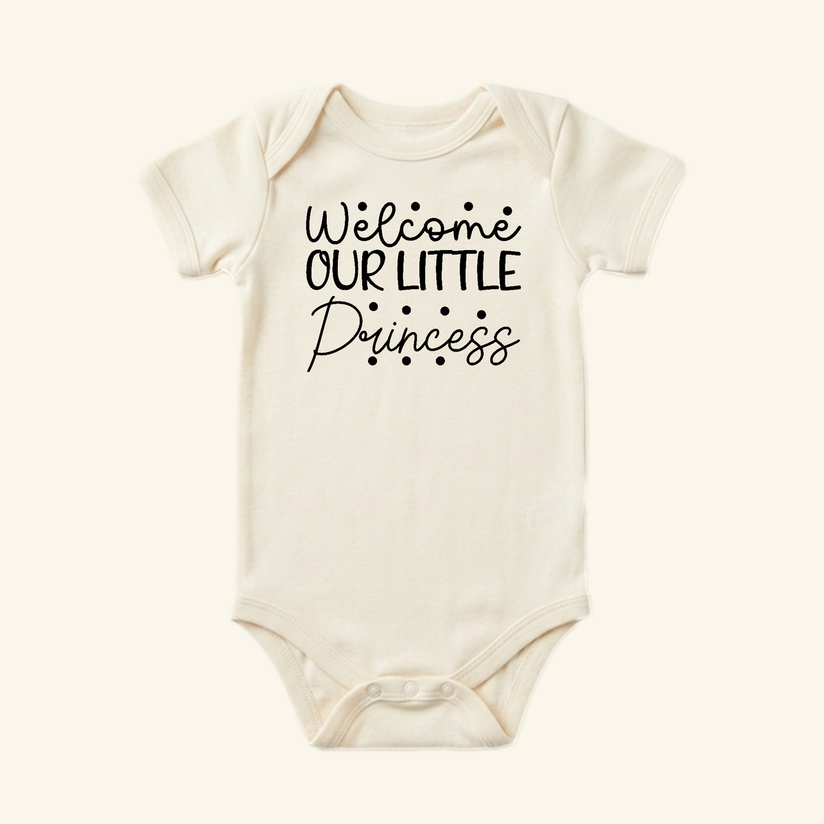 Cream-colored short-sleeve Baby Girl Onesie – Welcome Our Little Princess Bodysuit by Toodleroos, featuring the text Welcome OUR LITTLE Princess on the front.