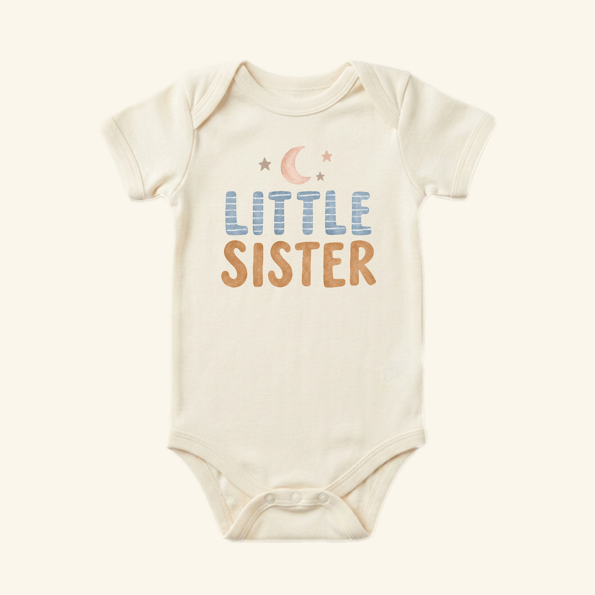 Cream Little Sister Baby Onesie – Moon and Stars Sibling Bodysuit featuring a crescent moon and stars above the text LITTLE SISTER in blue and brown, perfect as a newborn photos outfit.