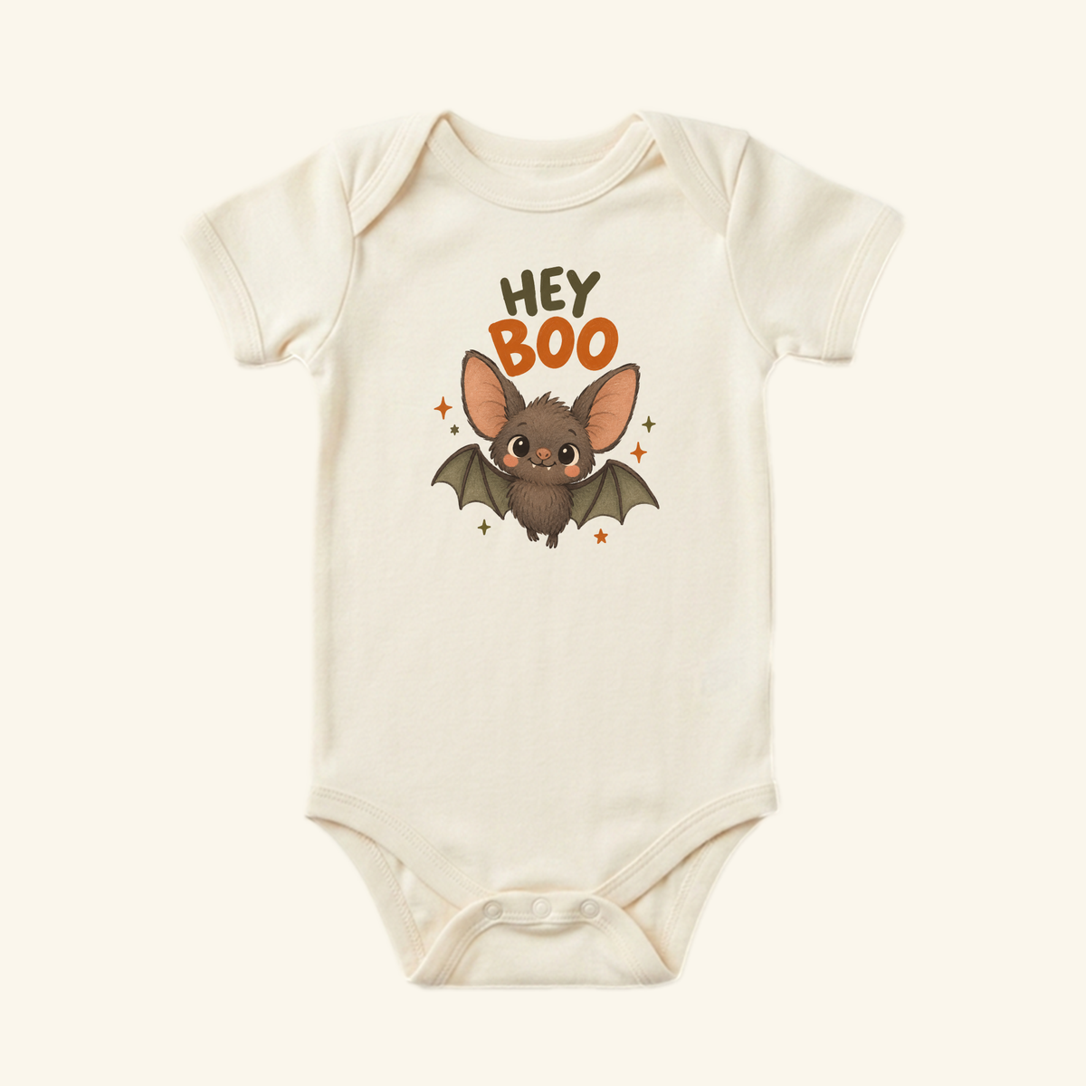 Cream-colored Toodleroos Hey Boo Bat Baby Halloween Onesie – Cute Bat Bodysuit featuring a cartoon bat and the text HEY BOO in the center.