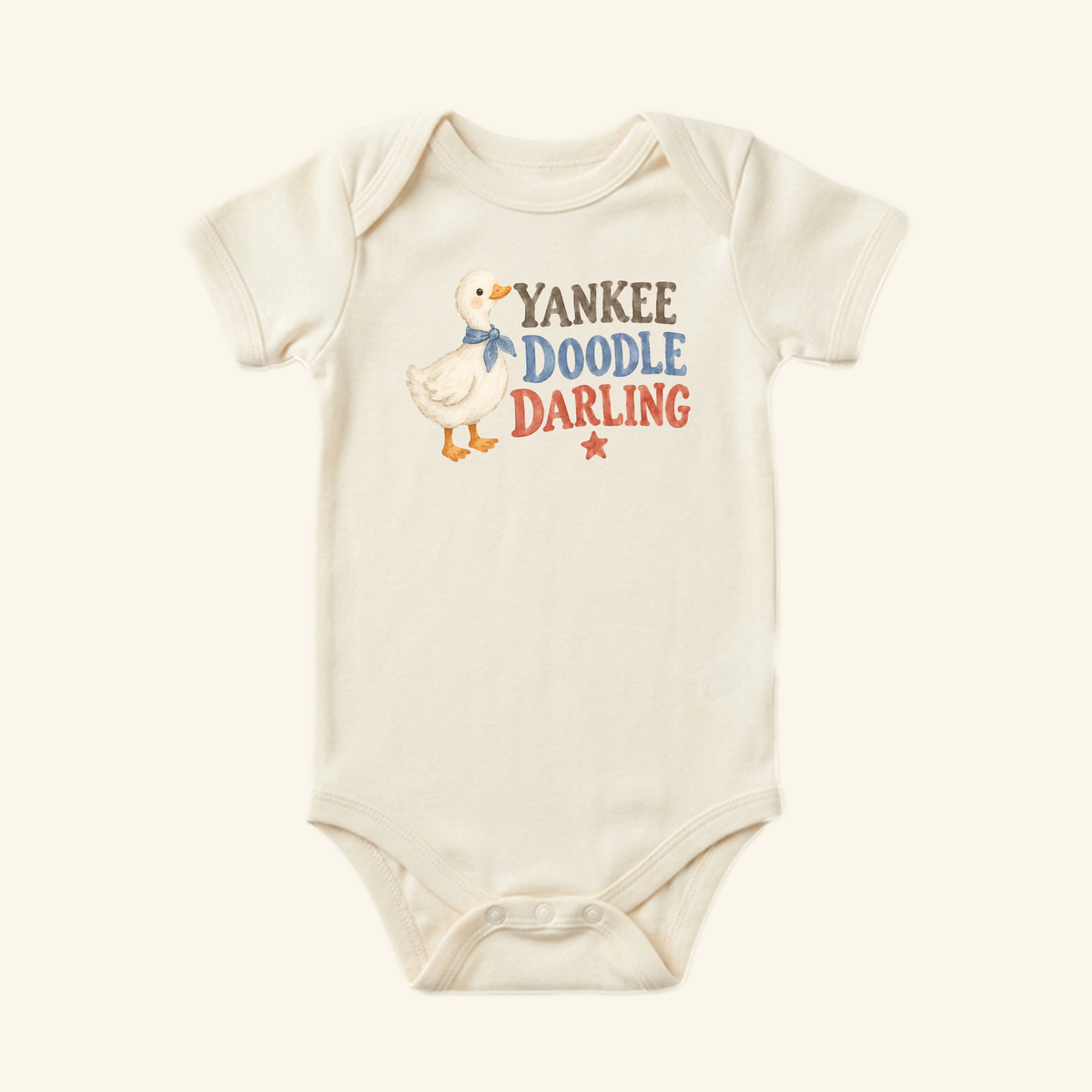 Cream-colored Yankee Doodle Darling Baby Onesie – Patriotic Duckling Bodysuit featuring a duckling in a blue scarf, the text YANKEE DOODLE DARLING, and a small red star.