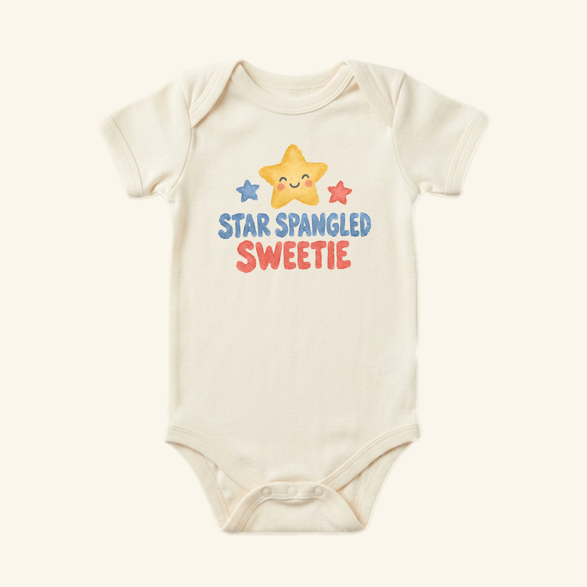 Toodleroos Star Spangled Sweetie Baby Onesie featuring an off-white bodysuit with a smiling yellow star between small blue and red stars and the text STAR SPANGLED SWEETIE printed below.