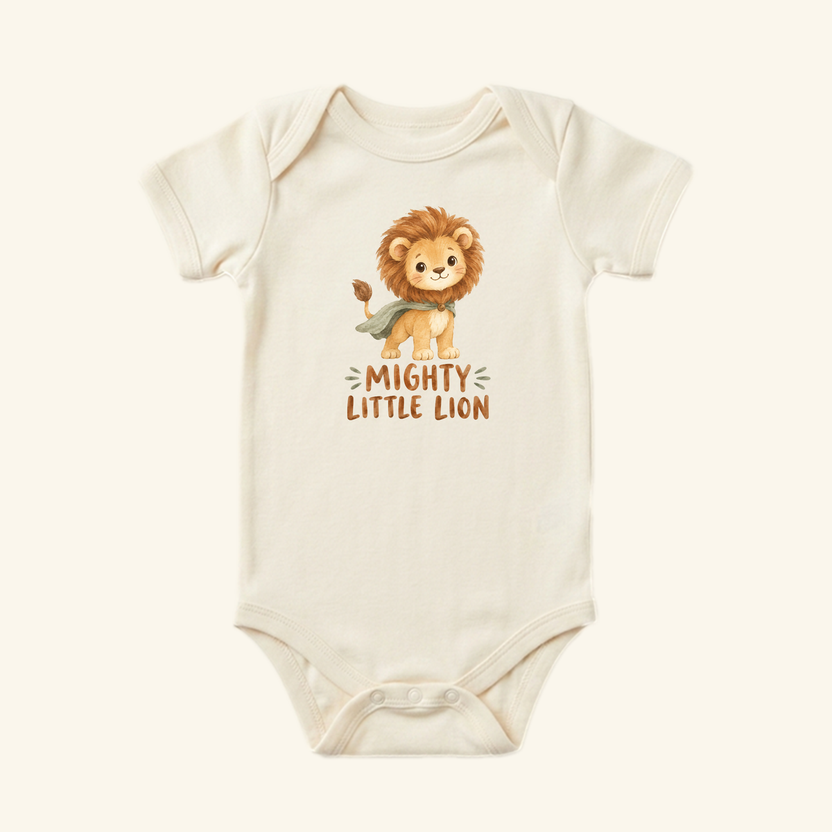 Off-white gender-neutral Mighty Little Lion Baby Onesie featuring a cartoon lion cub wearing a cape and the text Mighty Little Lion.