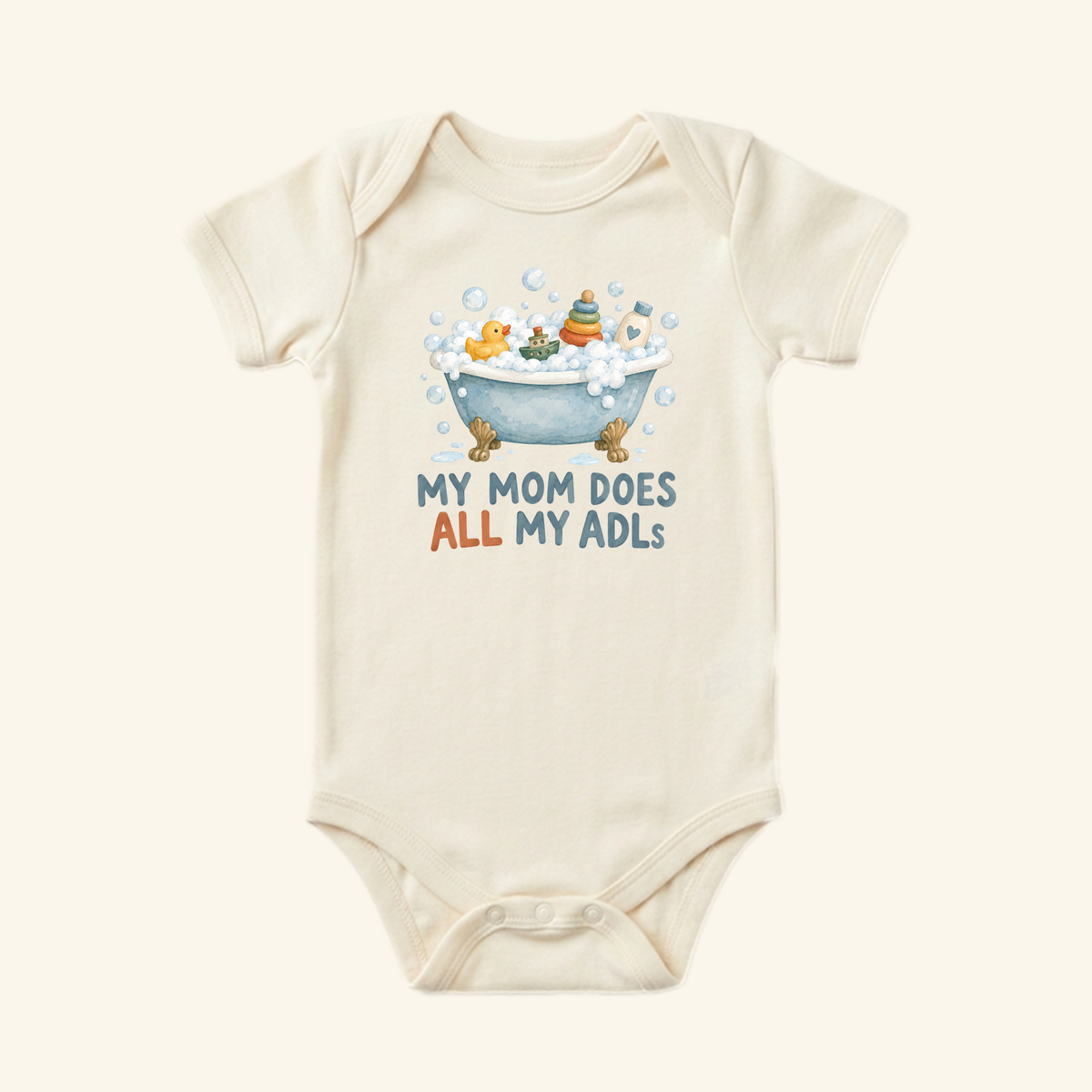 Cream-colored My Mom Does All My ADLs Baby Onesie with a graphic of a bathtub full of bubbles and toys and the text MY MOM DOES ALL MY ADLS.