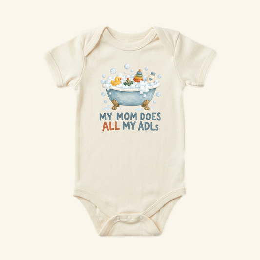 Cream-colored My Mom Does All My ADLs Baby Onesie with a graphic of a bathtub full of bubbles and toys and the text MY MOM DOES ALL MY ADLS.