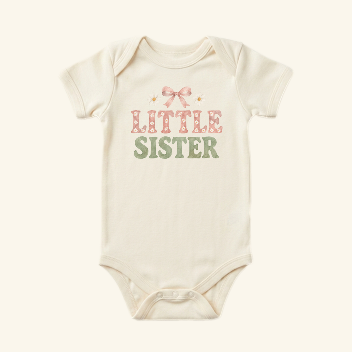 Toodleroos Little Sister Baby Onesie – Daisy Bow Sibling Bodysuit in cream, featuring a pink bow and the text in daisy-patterned lettering.