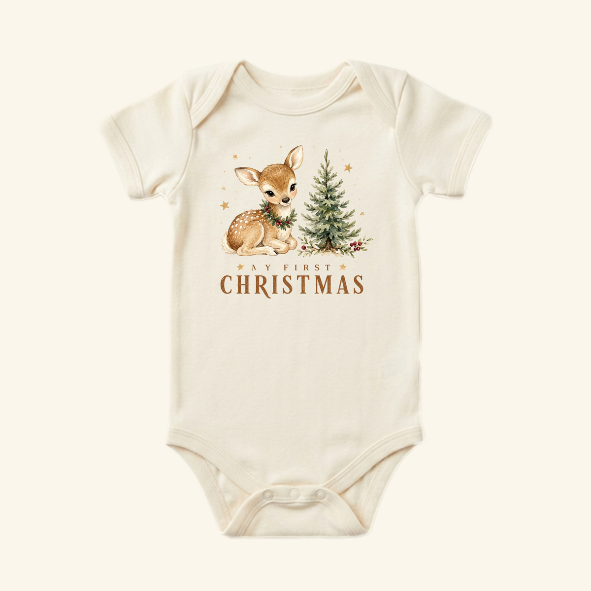 Cream-colored My First Christmas Baby Onesie – Woodland Fawn Bodysuit featuring a watercolor illustration of a fawn wearing a wreath next to a small Christmas tree with the text My First Christmas printed below.