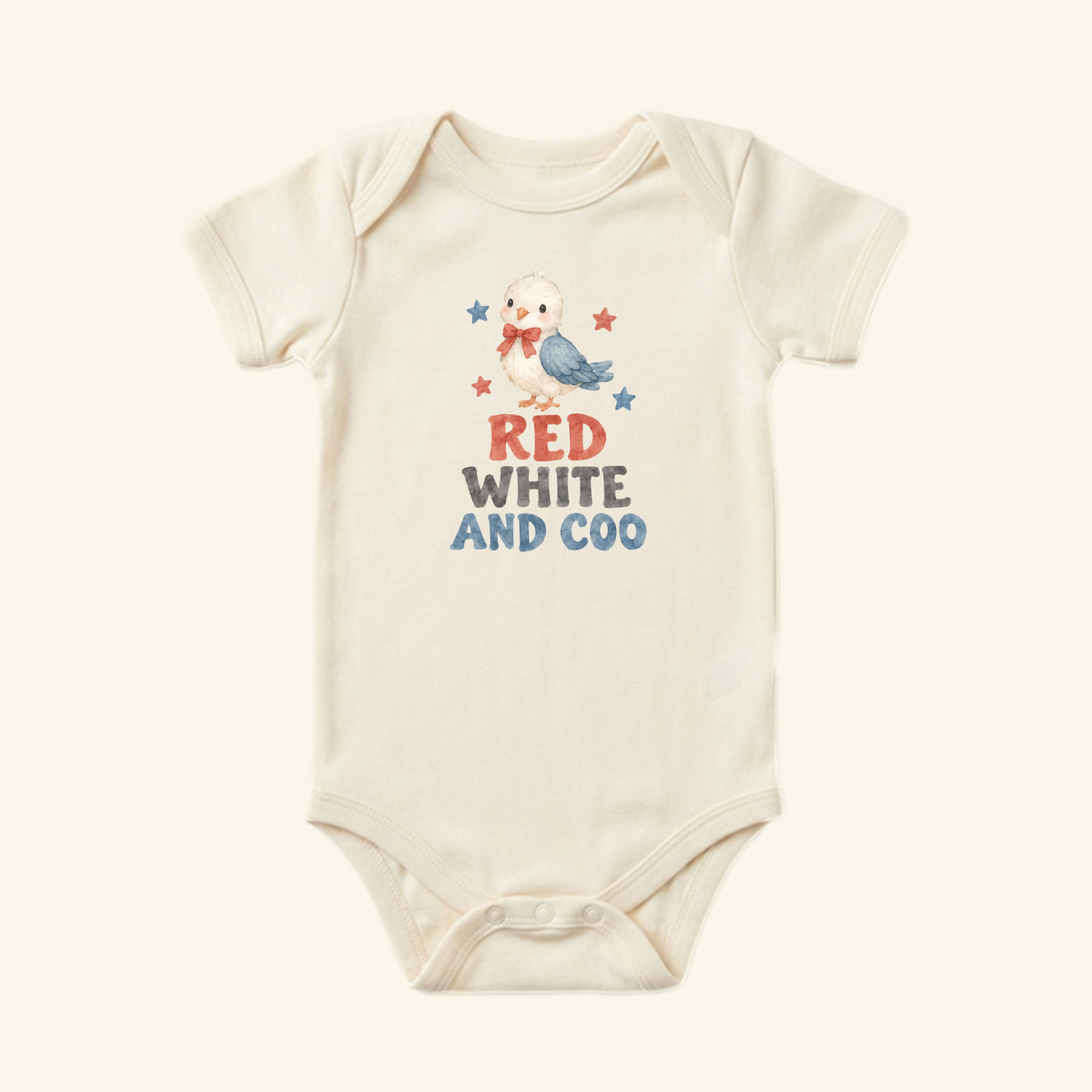 Cream-colored Red White and Coo Baby Onesie – Patriotic Little Bird Bodysuit featuring a watercolor illustration of a bird with a red bow, the text RED WHITE AND COO, and small red and blue stars.