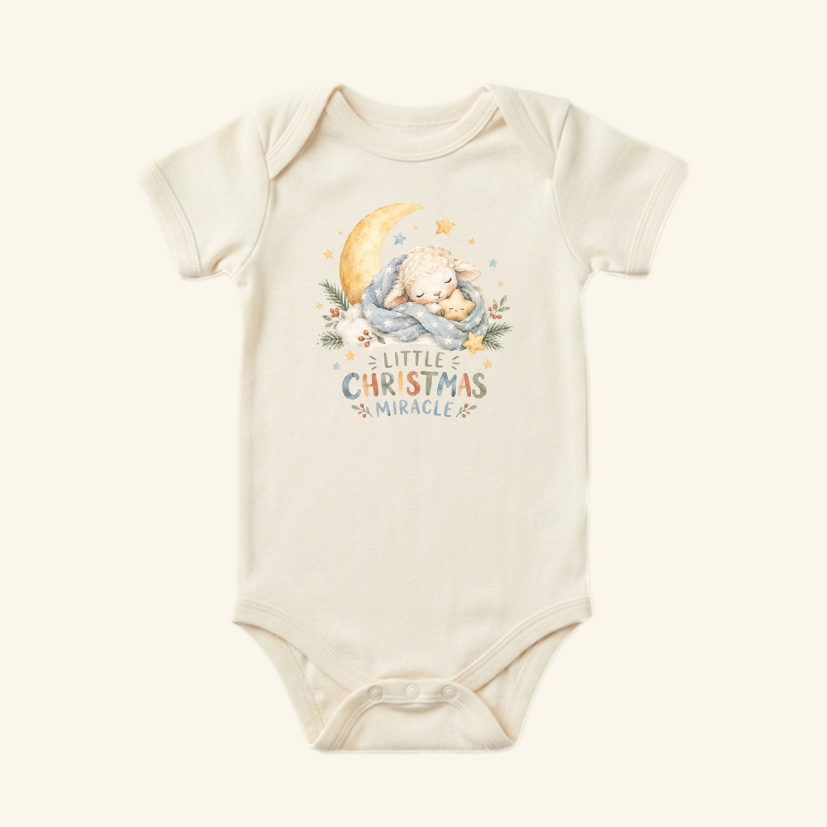 Little Christmas Miracle Baby Onesie – Sleeping Lamb Christmas Bodysuit featuring a short-sleeve baby bodysuit with a watercolor illustration of a lamb sleeping on a crescent moon.