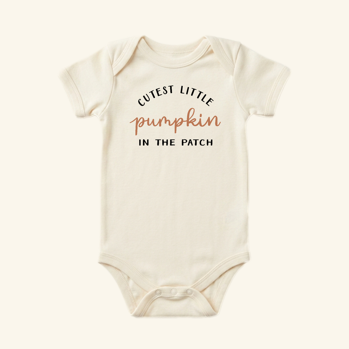 Cream-colored short-sleeved Pumpkin Baby Onesie – Cutest Little Pumpkin in the Patch Bodysuit with the text CUTEST LITTLE pumpkin IN THE PATCH printed on the front.