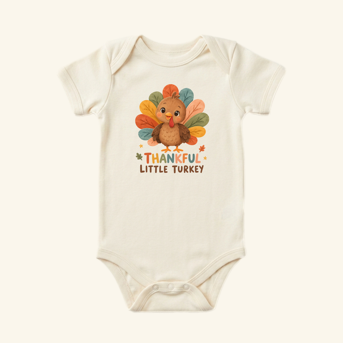 Cream-colored Thankful Little Turkey Baby Onesie – Thanksgiving Bodysuit for babies featuring a cartoon turkey with colorful feathers and the text THANKFUL LITTLE TURKEY.