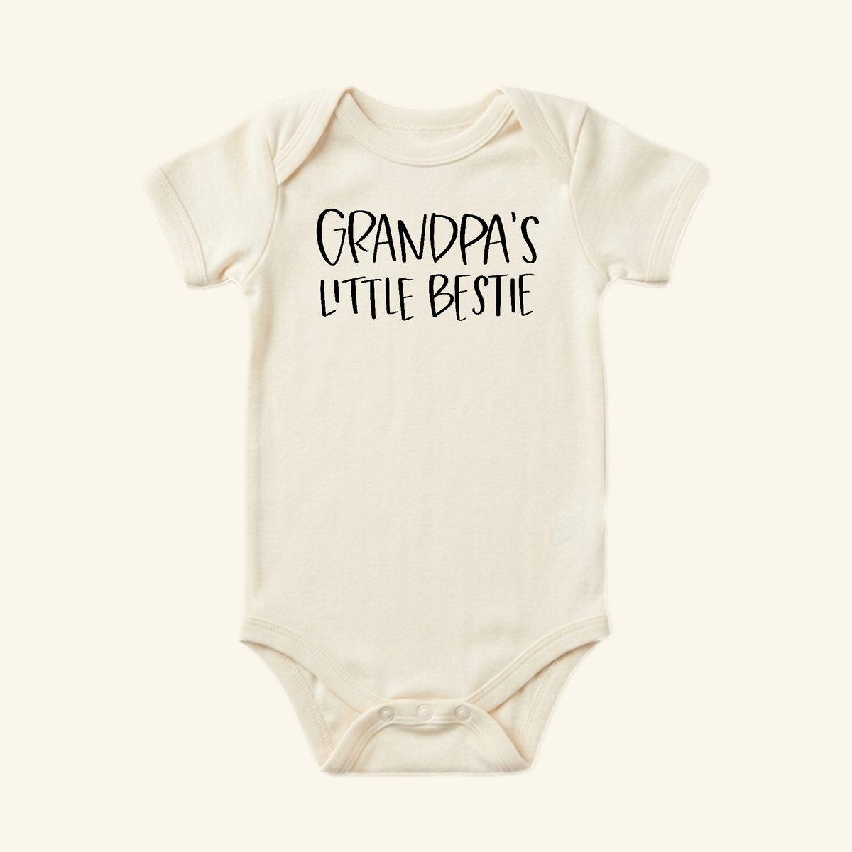 Off-white Toodleroos Grandpa Baby Onesie – Grandpa’s Little Bestie Bodysuit featuring Grandpa’s Little Bestie printed in black on the chest.