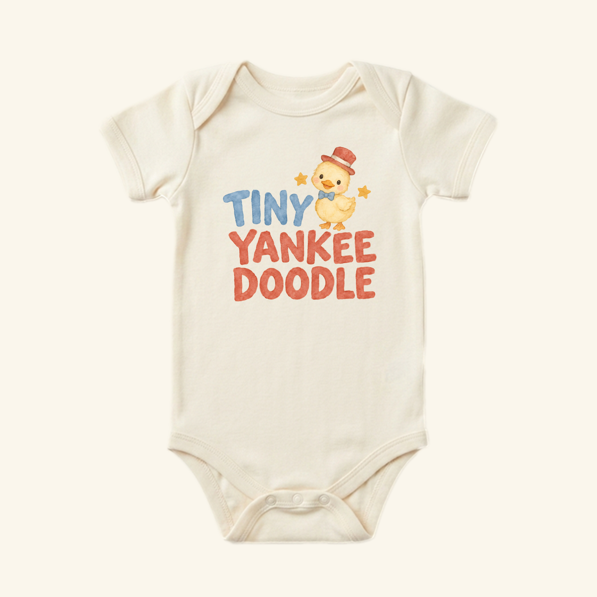 Cream-colored Tiny Yankee Doodle Baby Onesie – Patriotic Duckling Bodysuit featuring a watercolor illustration of a duckling wearing a red top hat and bow tie, with the text TINY YANKEE DOODLE printed above it.