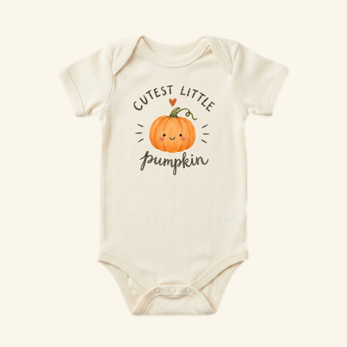 Cream-colored Cutest Little Pumpkin Baby Onesie featuring a cartoon pumpkin with a smiling face and the text CUTEST LITTLE pumpkin above and below it.