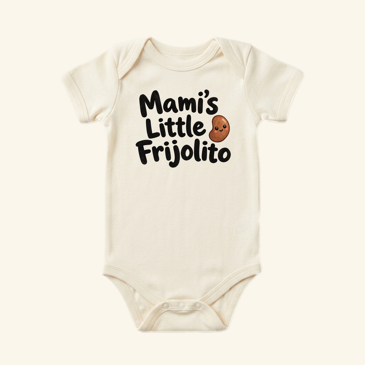 Cream-colored Mami’s Little Frijolito Baby Onesie featuring a cartoon bean with a smiling face.