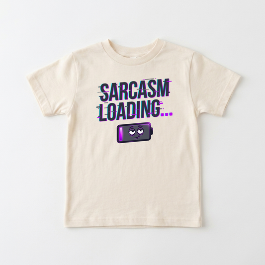 A cream-colored short-sleeve t-shirt with a graphic on the front that reads 'SARCASM LOADING.