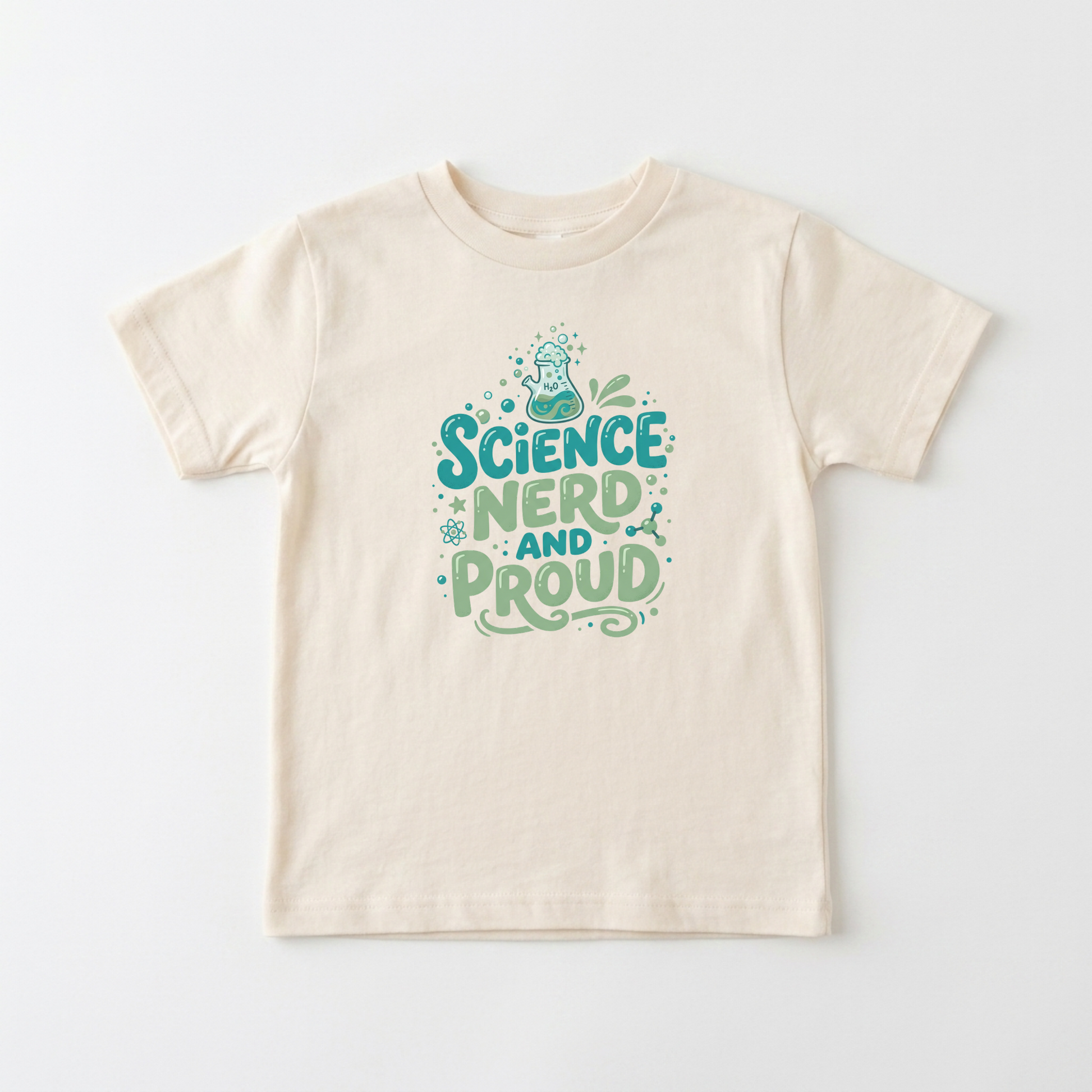 A cream-colored short-sleeve t-shirt with a 'Science Nerd and Proud' graphic printed on the chest in teal and green, displayed flat against a light gray background.