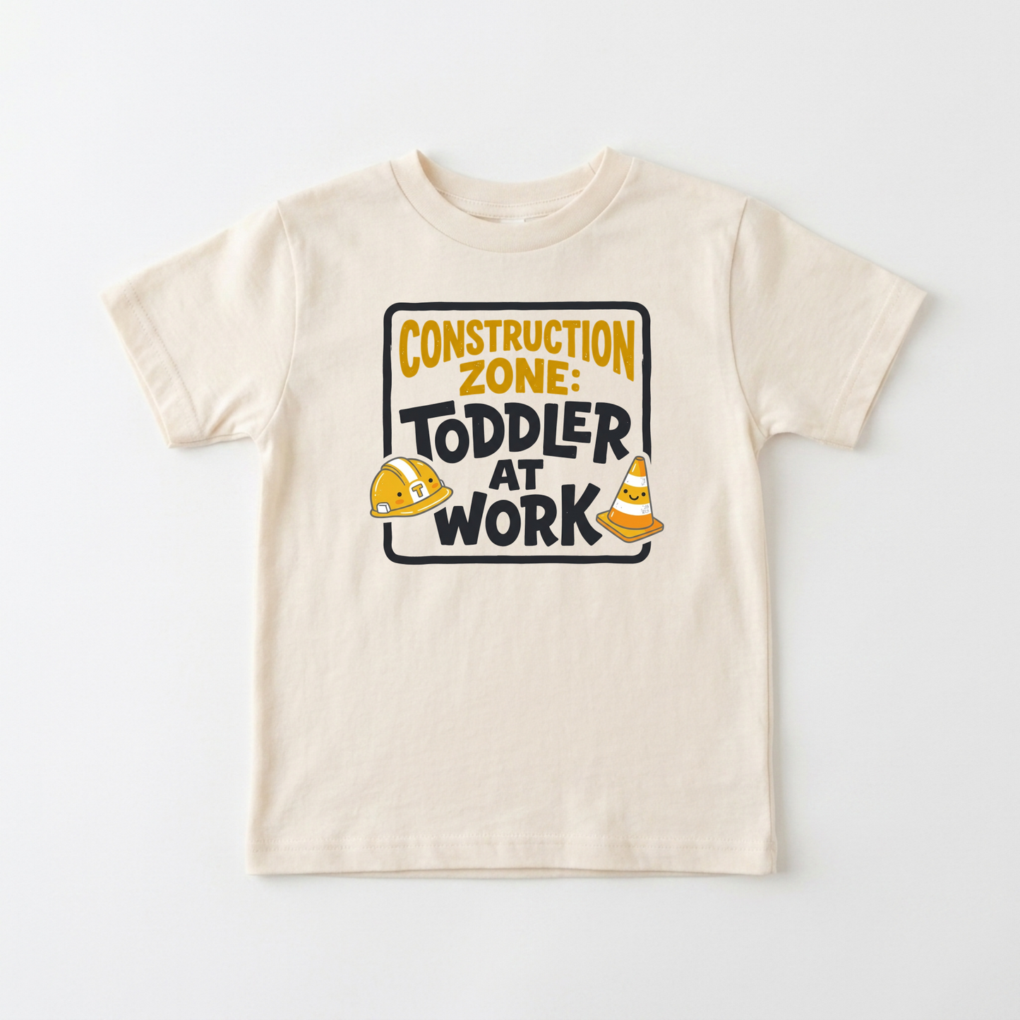 A cream-colored toddler short-sleeve t-shirt with a 'Construction Zone: Toddler at Work' graphic on the chest, displayed flat against a light gray background.