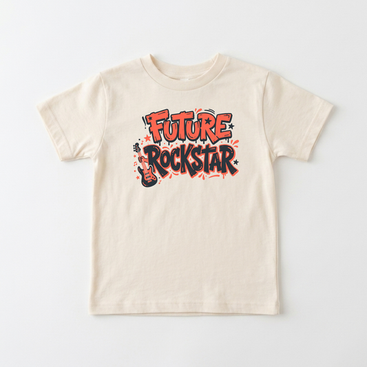 A cream-colored short-sleeve t-shirt with a colorful graphic on the chest that reads 'FUTURE ROCKSTAR' in red, orange, and black graffiti-style lettering, displayed flat against a light gray background.