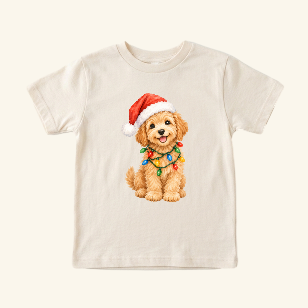 Christmas Puppy Toddler Shirt – Cute Goldendoodle Holiday Tee featuring a goldendoodle puppy wearing a Santa hat and wrapped in colorful Christmas lights.