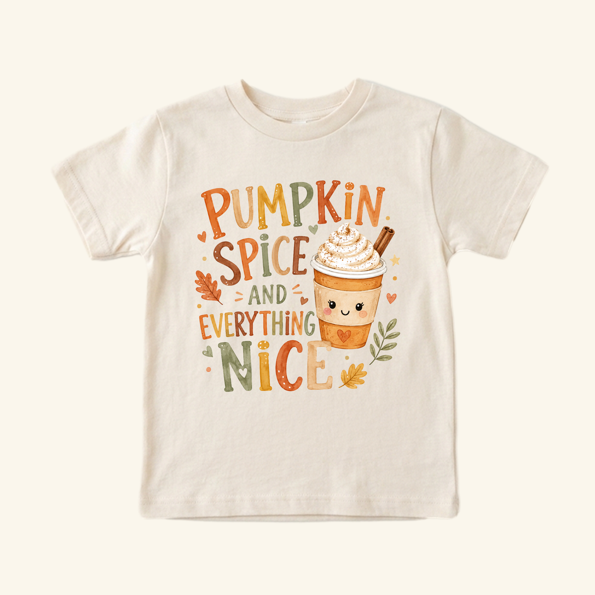 Cream-colored Pumpkin Spice and Everything Nice Toddler Shirt – Fall Latte Tee featuring a cute latte with whipped cream, fall leaves, and hearts.