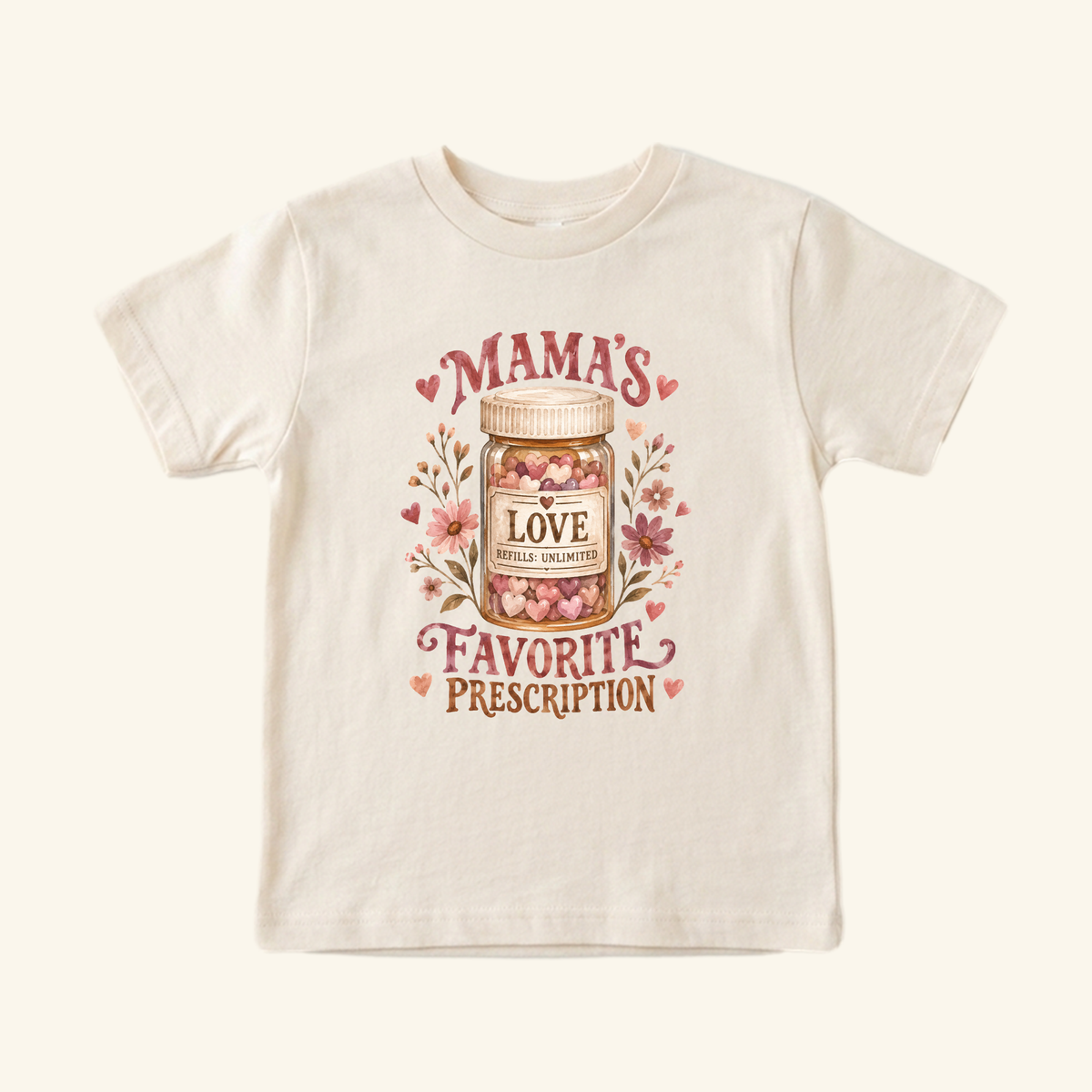 Light-colored Mama’s Favorite Prescription Toddler Shirt – Funny Pharmacy Mom Tee featuring a medicine bottle filled with hearts, surrounded by flowers and the text Mamas Favorite Prescription, Love, Refills: Unlimited.