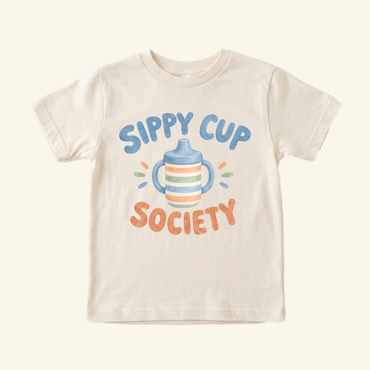 Cream-colored Sippy Cup Society Toddler Shirt featuring a watercolor graphic of a sippy cup and the text Sippy Cup Society.