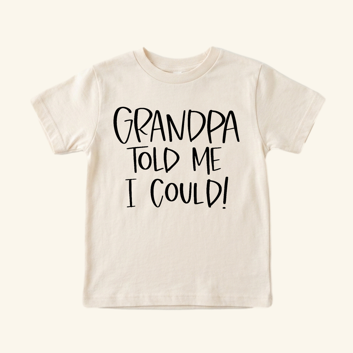 Cream-colored Funny Grandpa Toddler Shirt – Grandpa Told Me I Could Short-Sleeve Tee with the text printed in black.