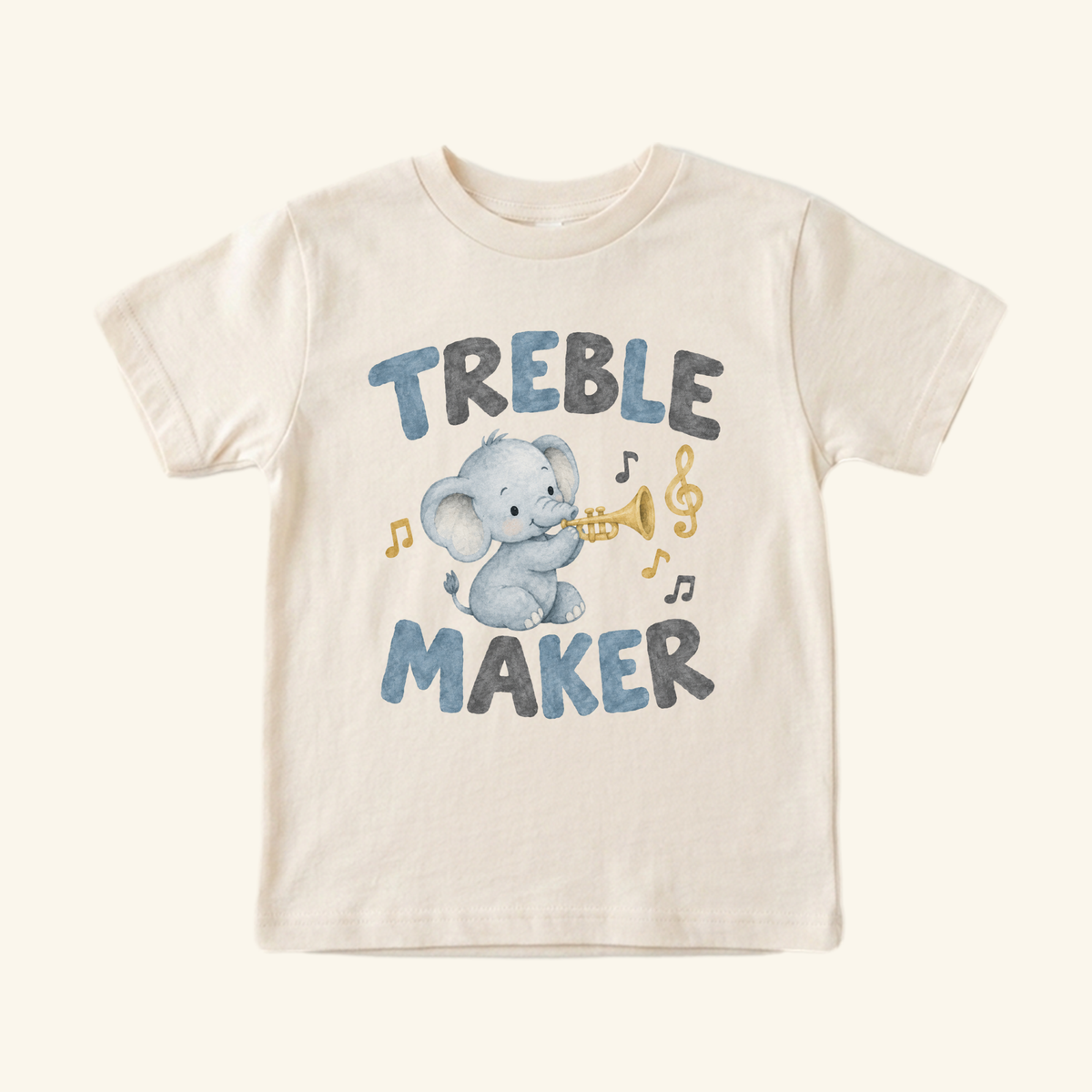 Cream-colored Treble Maker Toddler Shirt featuring an illustration of an elephant playing a trumpet, with the text TREBLE MAKER and musical notes.