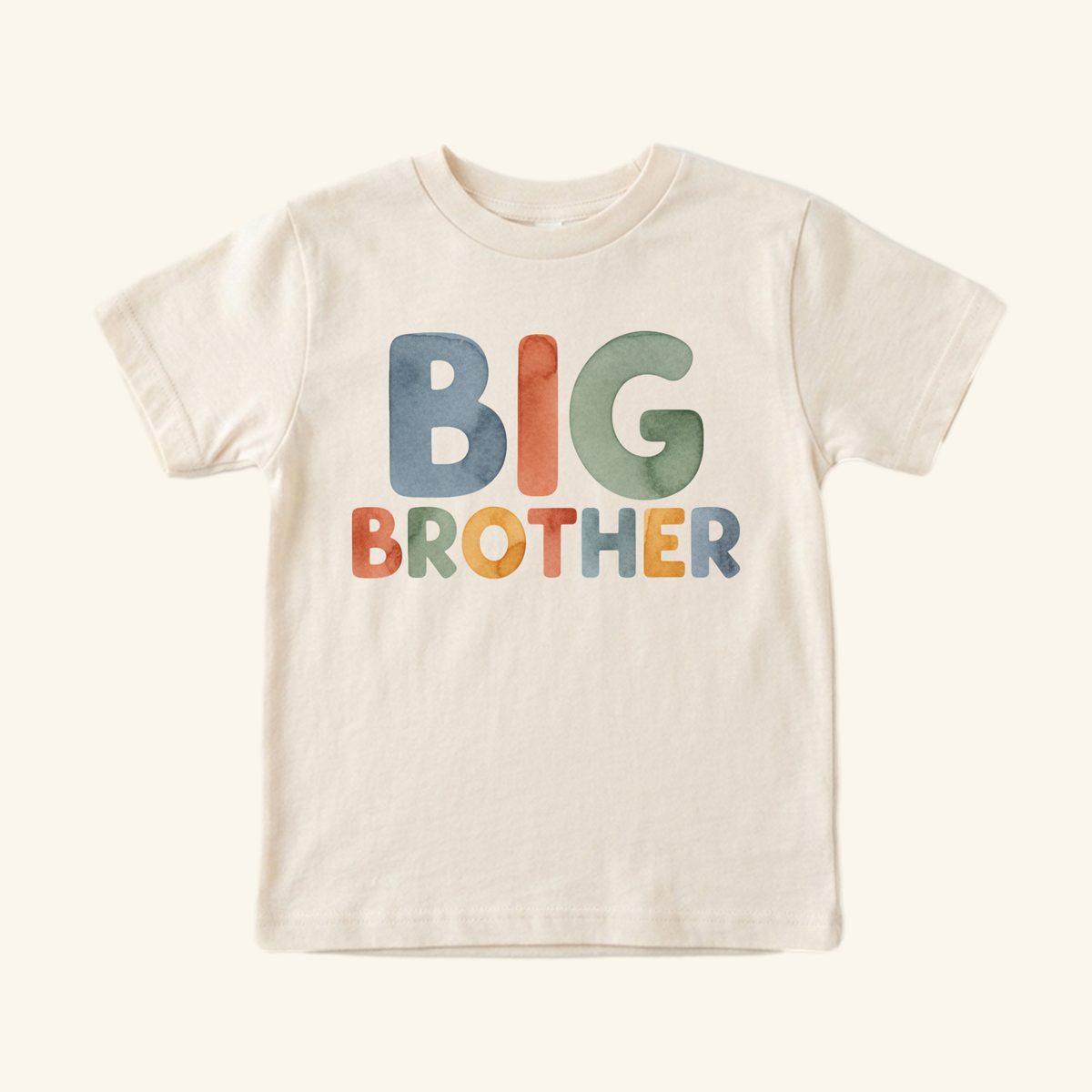 Big Brother Watercolor Toddler Shirt featuring short sleeves and the words BIG BROTHER in multicolored, watercolor-style block lettering.