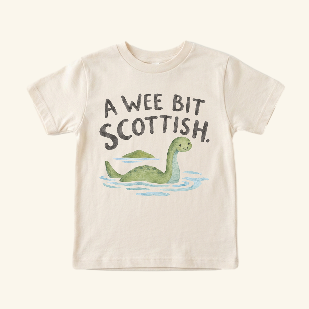 A Wee Bit Scottish Toddler Shirt – Cute Loch Ness Monster Heritage Tee with a watercolor illustration of the Loch Ness monster in water and the text A WEE BIT SCOTTISH.