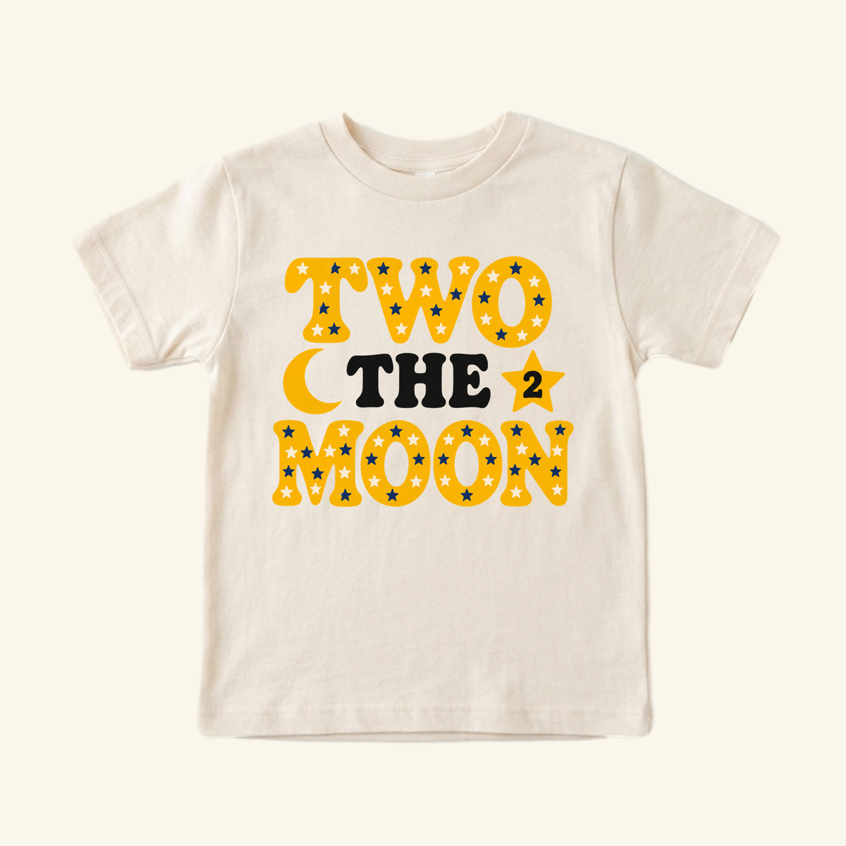 Cream-colored 2nd Birthday Toddler Shirt – Two the Moon Celestial Tee featuring yellow text, blue stars, a crescent moon, and a number 2 star icon.