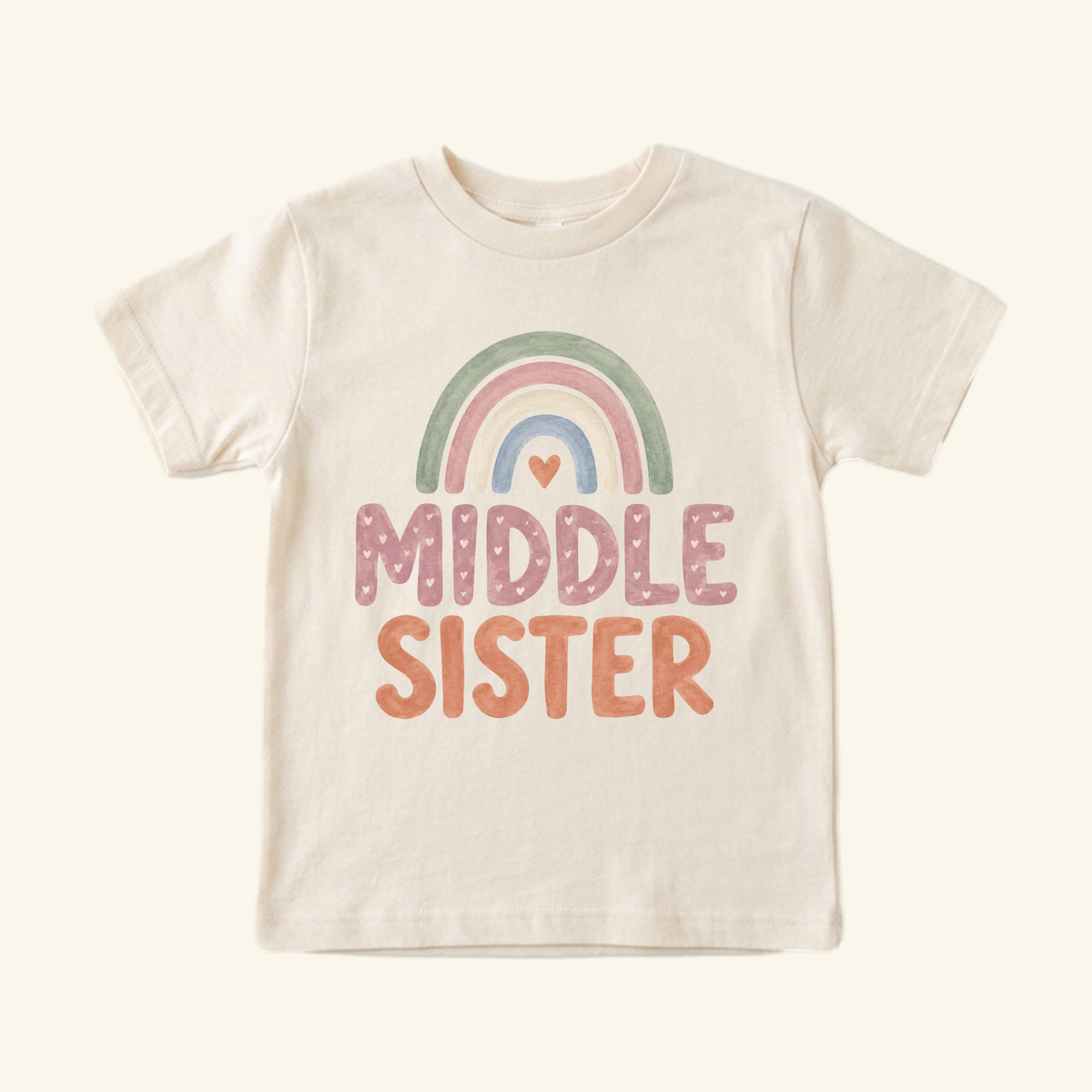 Light-colored Middle Sister Toddler Shirt – Boho Rainbow Sibling Tee featuring a boho rainbow graphic and the text MIDDLE SISTER.